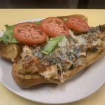 José’s Hoagie. This picture the pics grilled chicken with sautéed Mushrooms and onions, melted mozzarella cheese, lettuce and tomato on an open faced semolina sub Served on Johny’s countertop