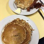 pancakes. This picture indicates an idea of what the pancakes and Johnys Luncheonette look like when you eat it in. It is a picture two orders of pancakes on Johny’s yellow counter
